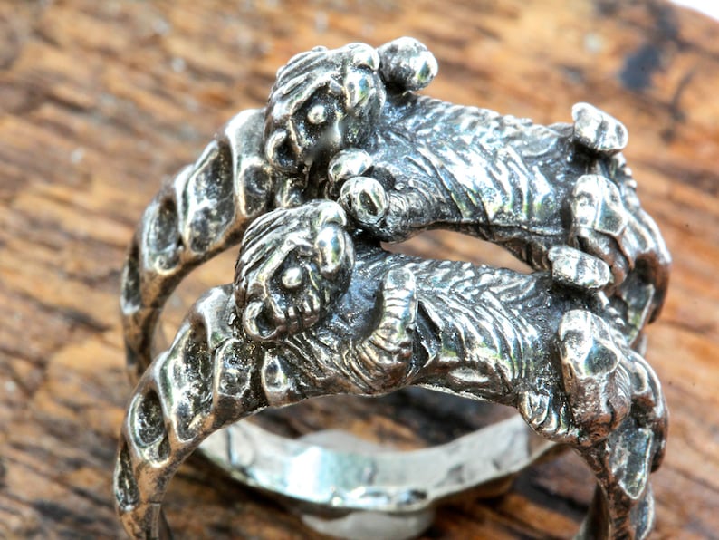 Otters holding hands rings set of two Sterling silver Blue Bayer Design NYC