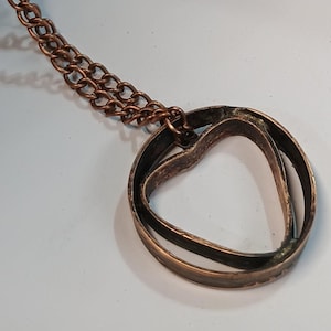 Circle heart pendant necklace with chain.
