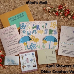 May include: An assortment of paper crafts and ephemera, including a postcard, envelope, and cards with floral and umbrella designs. The text "April Showers" is featured prominently, with the words "Mimi's Mail" at the top.