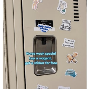 May include: A collection of stickers, approximately 3 inches in size, on a beige locker. The stickers have various designs and text, including "Belly Button Cleaning Crew" and "Nurse week special." The image also includes a metal locker compartment.