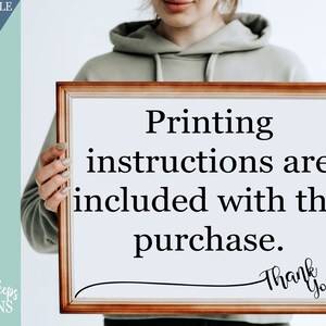 May include: A person holding a framed sign with the text "Printing instructions are included with the purchase. Thank you!"