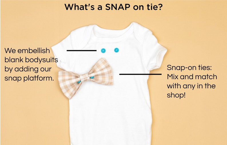May include: A white onesie with a brown and white plaid bow tie. The onesie has two turquoise snaps on the neckline. The text "What's a SNAP on tie?" is at the top of the image. The text "We embellish blank bodysuits by adding our snap platform." is on the left side of the image. The text "Snap-on ties: Mix and match with any in the shop!" is on the right side of the image.