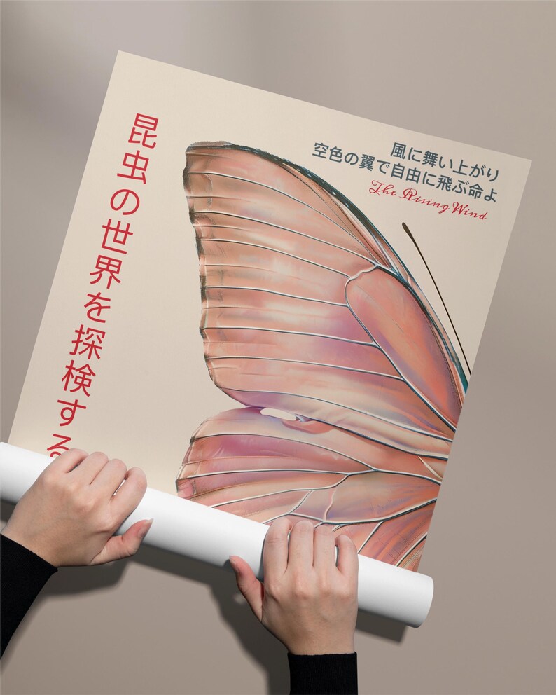 May include: A poster with a large, detailed illustration of a butterfly wing in shades of pink and peach. The text "The Rising Wind" is written in black lettering, and the text "空色の翼で自由に飛ぶ命よ" is written in red lettering. The text "昆虫の世界を探検する" is written in red lettering on the left side of the poster.
