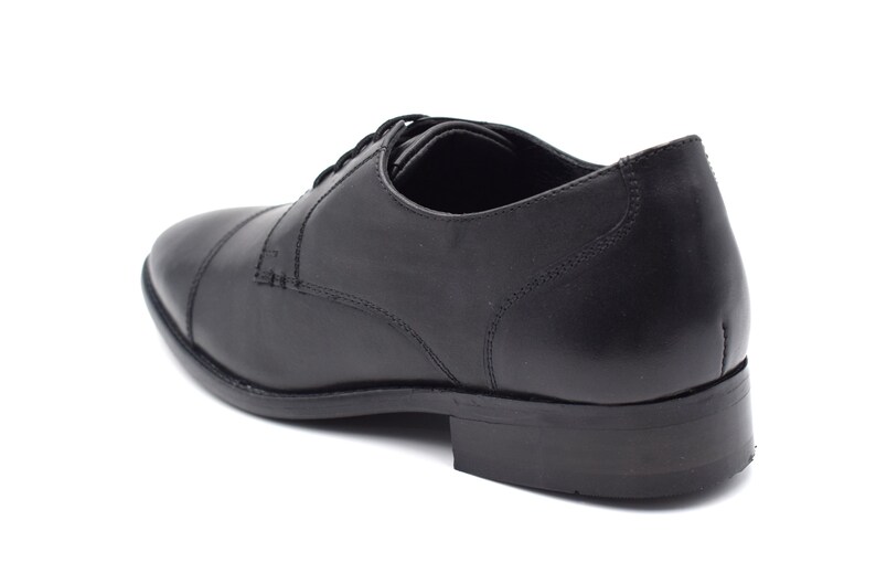 May include: Black leather lace-up dress shoe with a closed toe and a rounded heel.