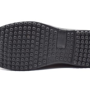 May include: Black rubber shoe sole with a textured pattern of small dots and a larger plus sign.