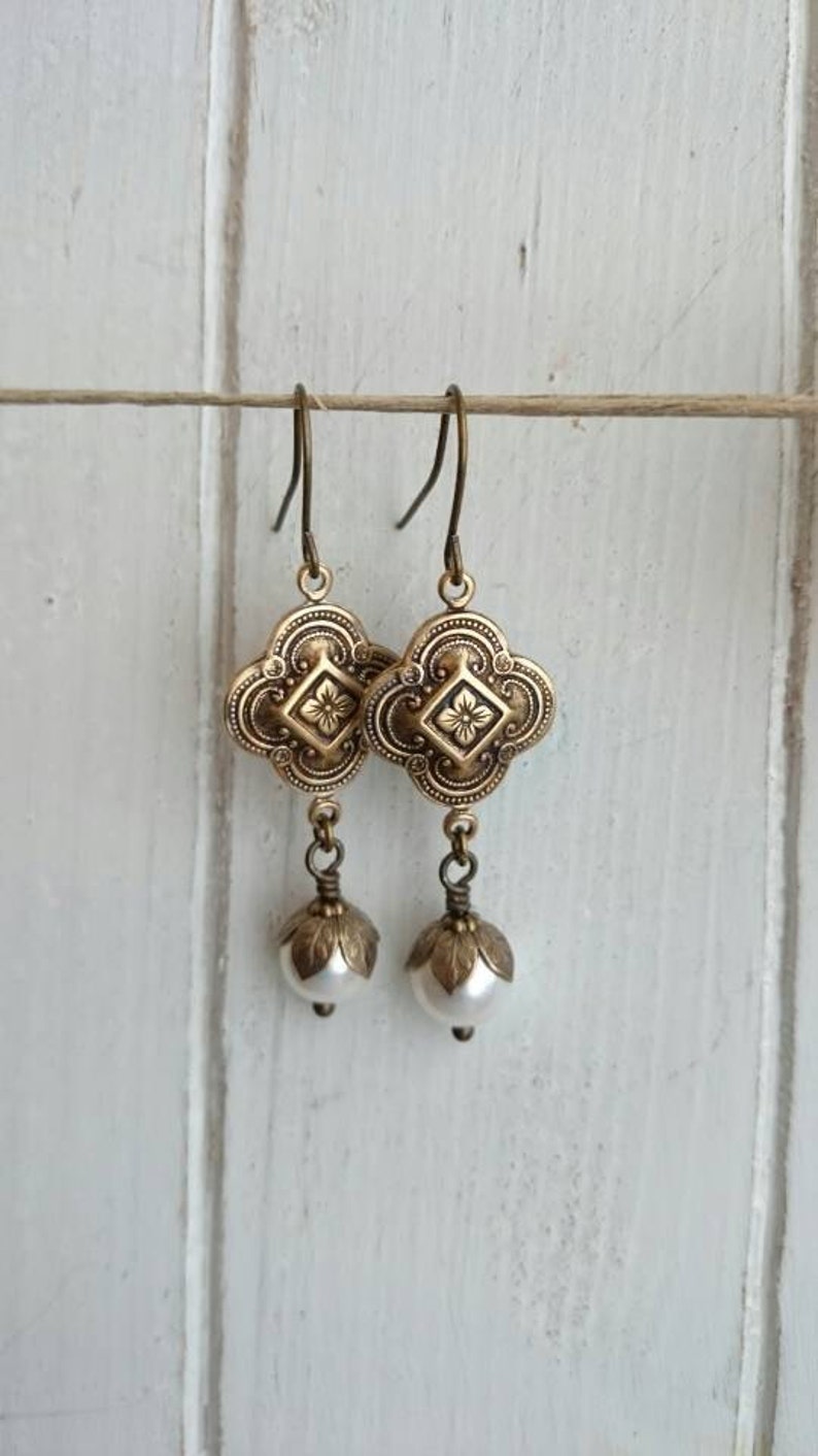 Vintage style Dangle earrings antique brass attached with crystal pearl. image 2