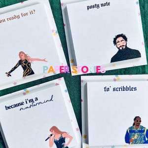 May include: Four white sticky note pads with colorful borders and different text and illustrations. The top left pad says "are you ready for it?" and features a woman singing. The top right pad says "posty note" and features a man with a beard. The bottom left pad says "because i'm a mastermind" and features a woman singing. The bottom right pad says "fo' scribbles" and features a man with a beard and a microphone.