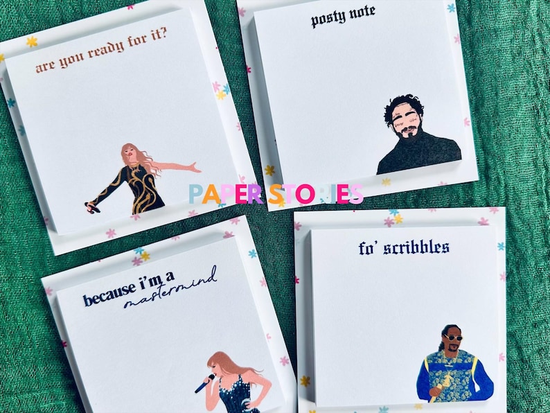 May include: Four white sticky note pads with colorful borders and different text and illustrations. The top left pad says "are you ready for it?" and features a woman singing. The top right pad says "posty note" and features a man with a beard. The bottom left pad says "because i'm a mastermind" and features a woman singing. The bottom right pad says "fo' scribbles" and features a man with a beard and a microphone.