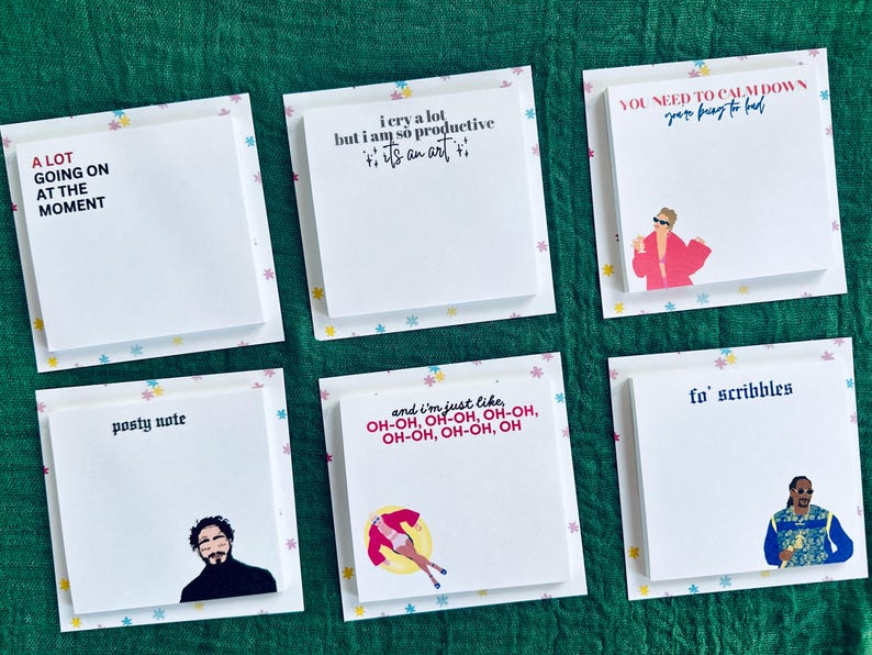 May include: Six colorful sticky note pads with different designs and text. The text on the pads includes "A lot going on at the moment", "I cry a lot but I am so productive, it's an art", "You need to calm down, you're being to hard", "Posty note", "And I'm just like, oh-oh, oh-oh, oh-oh, oh-oh, oh-oh, oh", and "Fo' scribbles".