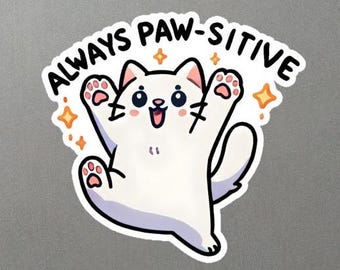 May include: White cat with pink ears and a happy expression, with arms raised in the air, surrounded by yellow stars. The text "ALWAYS PAW-SITIVE" is written in black above the cat.