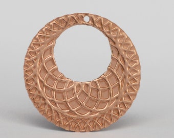 May include: A copper-colored metal pendant with a circular shape and a delicate, intricate design. The pendant has a hole at the top for hanging.
