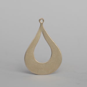 May include: A gold-toned metal pendant shaped like a teardrop with a hole at the top for hanging.