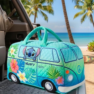 May include: A teal and blue quilted travel bag shaped like a vintage van, featuring the character Stitch. The bag has a top handle and is decorated with tropical flowers and leaves. The name "Henry" is embroidered on the side.