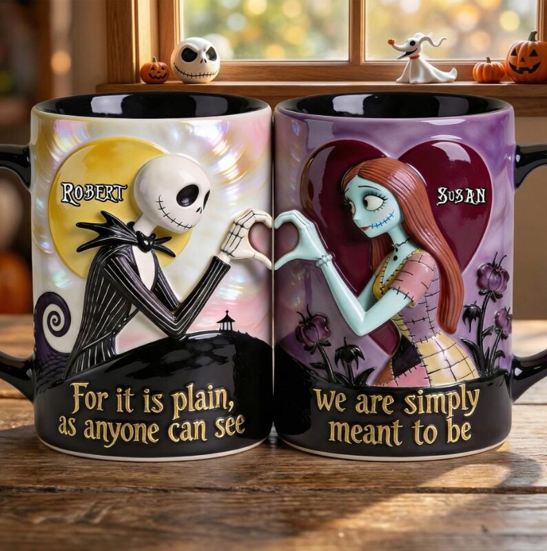 May include: Two ceramic mugs featuring Jack Skellington and Sally from The Nightmare Before Christmas. Jack is on a moon background, Sally on a heart. Text reads "For it is plain, as anyone can see" and "We are simply meant to be."