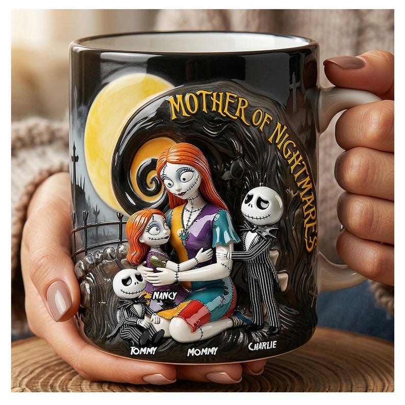 May include: Black ceramic mug featuring a 3D relief design with characters from The Nightmare Before Christmas. The mug has a full moon background and the words "MOTHER OF NIGHTMARES". The names "Tommy", "Nancy", "Mommy", and "Charlie" are also visible.