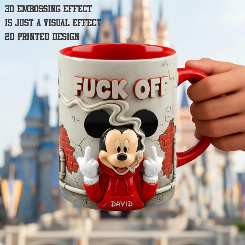 May include: A ceramic mug with a red interior and handle, featuring a cartoon mouse character in a red hoodie, giving the middle finger and smoking a cigarette. The mug has the words "FUCK OFF" in white and the text "3D EMBOSSING EFFECT IS JUST A VISUAL EFFECT 2D PRINTED DESIGN".