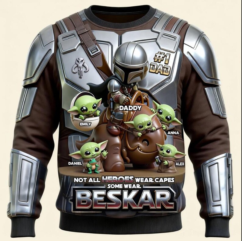 Puede incluir: Sudadera marr&oacute;n y plateada con un dise&ntilde;o inspirado en el Mandaloriano, personajes de Grogu y el texto "#1 DAD". El dise&ntilde;o incluye el texto "NOT ALL HEROES WEAR CAPES SOME WEAR BESKAR".