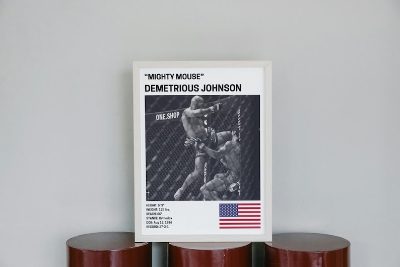 a framed poster of Demetrious Johnson, a professional mixed martial artist, with a focus on his fighting stance and technique.
