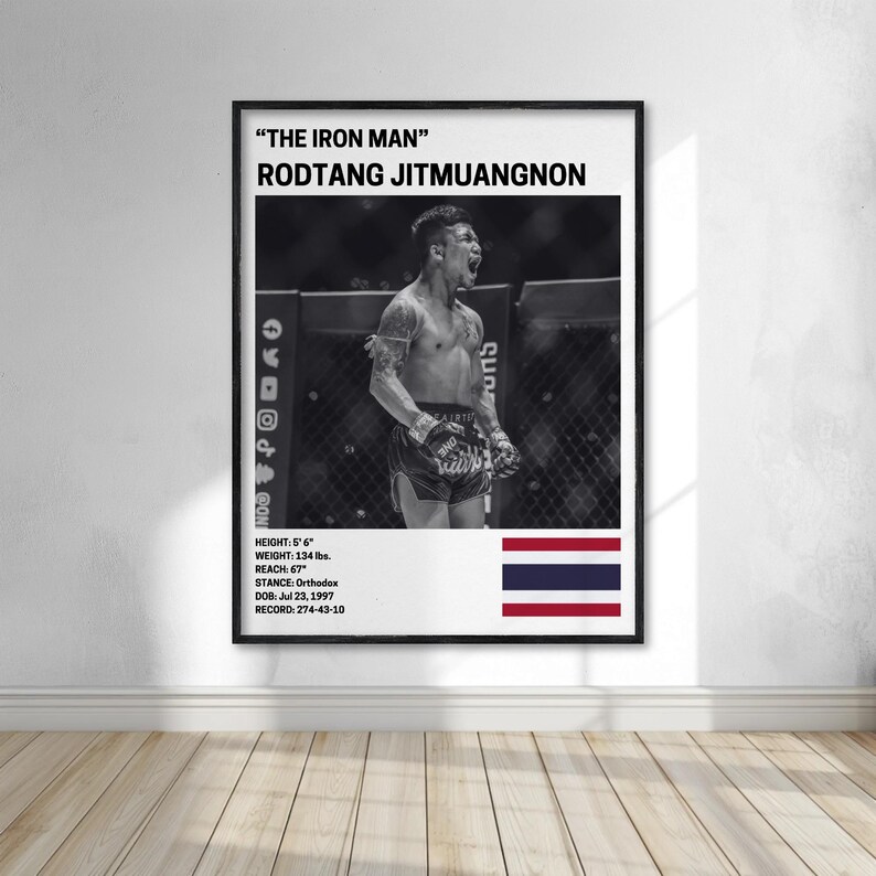 The image is a framed poster featuring a black and white photograph of a male fighter, likely Rodtang Jitmuanon, who is known for his fighting skills.