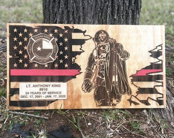 May include: A wooden plaque with a distressed American flag design, a firefighter silhouette, and the text "CEDAR PARK FIRE DEPT. DUTY HONOR COMMUNITY SAFETY", "LT. ANTHONY KING #910 24 YEARS OF SERVICE DEC. 17, 2001-JAN. 17, 2025".