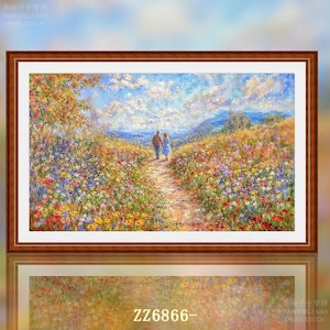May include: A framed landscape painting depicts a couple walking on a path through a field of colorful wildflowers. The artwork features a blue sky with fluffy clouds and distant mountains. The frame is a dark brown color, and the painting is labeled "ZZ6866-".