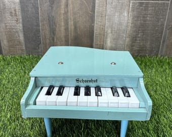 Piano de juguete Schoenhut vintage, mini teclado funcional de 3 patas, tamaño escritorio infantil, color azul.