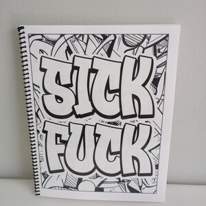 May include: A spiral-bound coloring book with the words "SICK FUCK" in large, bold, white letters. The background is filled with black and white graffiti-style art.