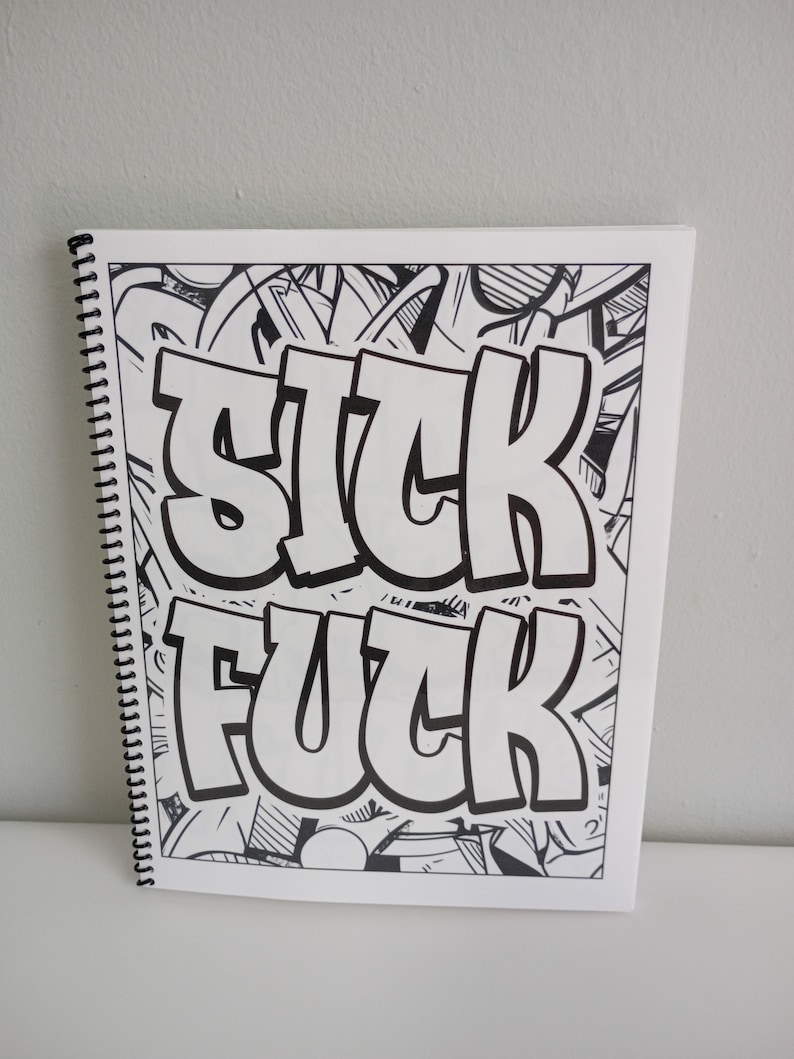 May include: A spiral-bound coloring book with the words "SICK FUCK" in large, bold, white letters. The background is filled with black and white graffiti-style art.