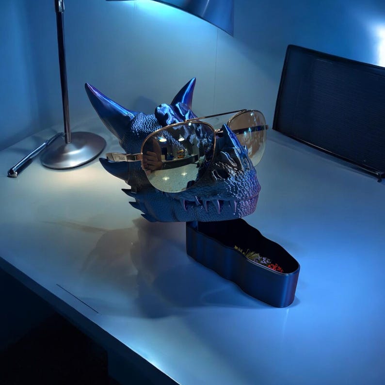 Dark gradient purple dragon head with glasses arms, cellphone holder and storage tray, functional 3D printed decor.