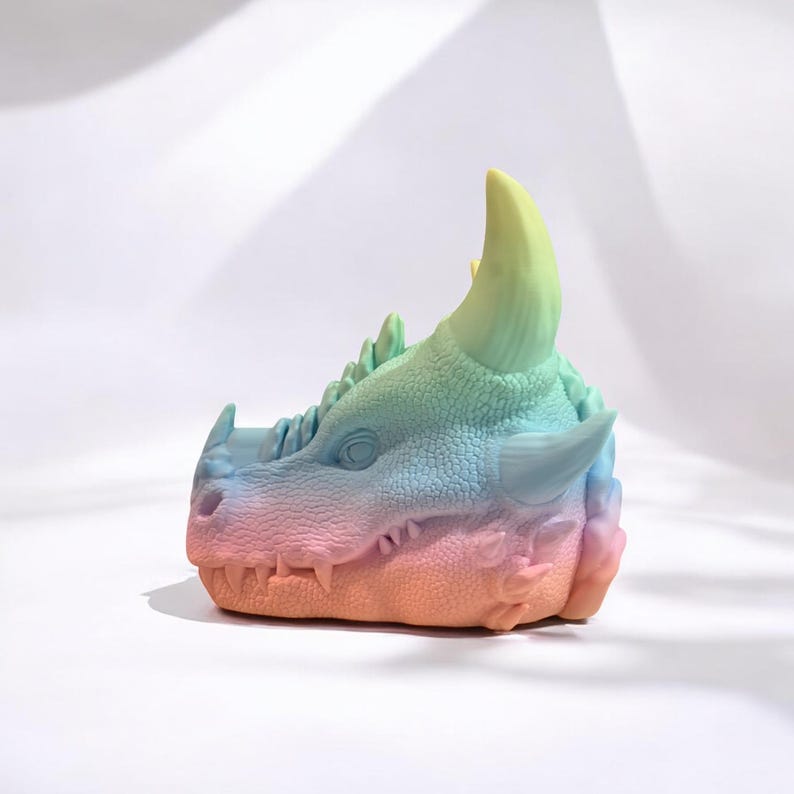 Colorful gradient 3D printed dragon head with large horns, handmade fantasy decor.