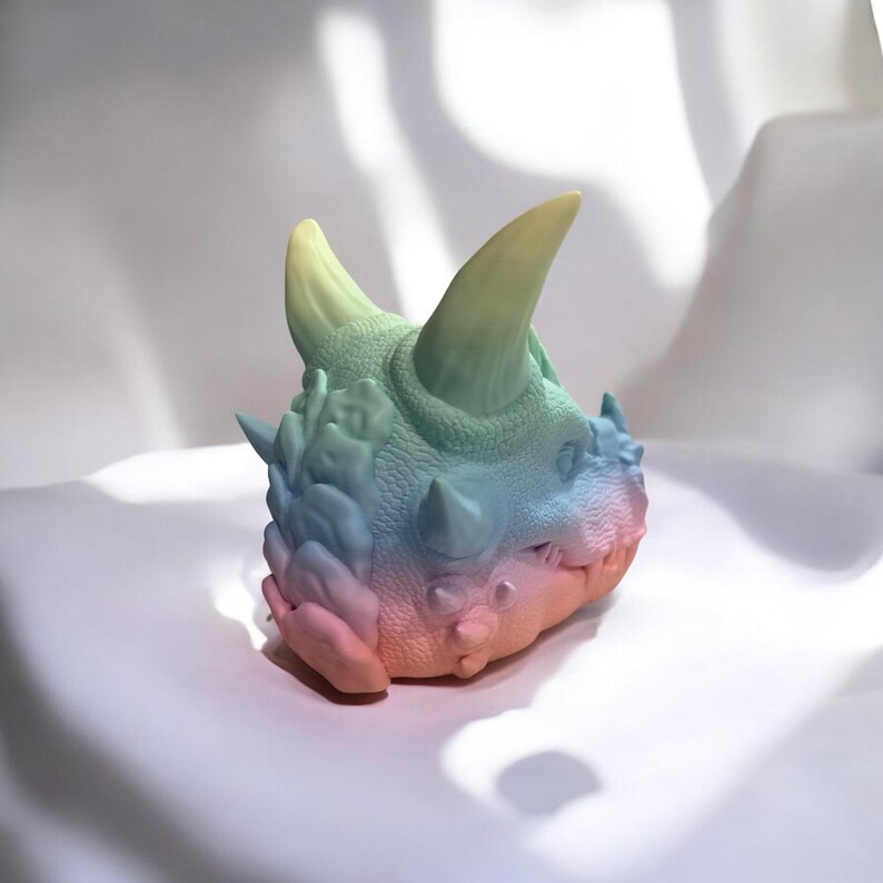 Matte Rainbow dragon desk figure, showing surface detail and print texture under soft light.