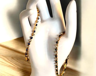 Conjunto vintage de 2 pulseras de tenis Avon con diamantes de imitación en tono dorado, verde y azul, años 80