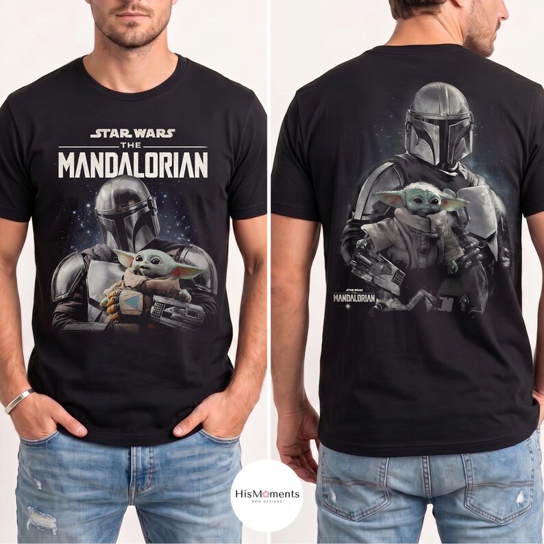May include: Black t-shirt featuring the text "STAR WARS THE MANDALORIAN" above an image of the Mandalorian holding Grogu. The back of the shirt shows the Mandalorian and Grogu. The shirt is a crew neck.