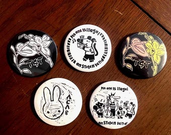 Verschiedene 58 mm Buttons T4T, anarchist, niemand geht Illegal auf gestohlenes Land.