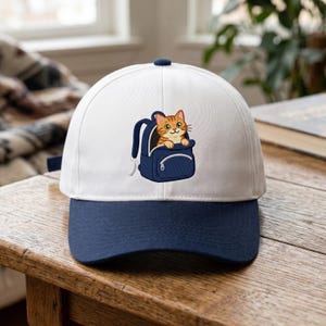 Embroidered Kitty in Carrier Hat, Cat Backpack Adventure Cap, Ginger Tabby Travel Hat, Gift for Cat Moms, Cute Pet Lover Two-Tone Cap