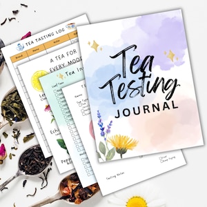 May include: A watercolor-style journal cover with the text "Tea Testing Journal" in black. The cover features a pink, blue, and purple watercolor background with gold stars and floral illustrations.