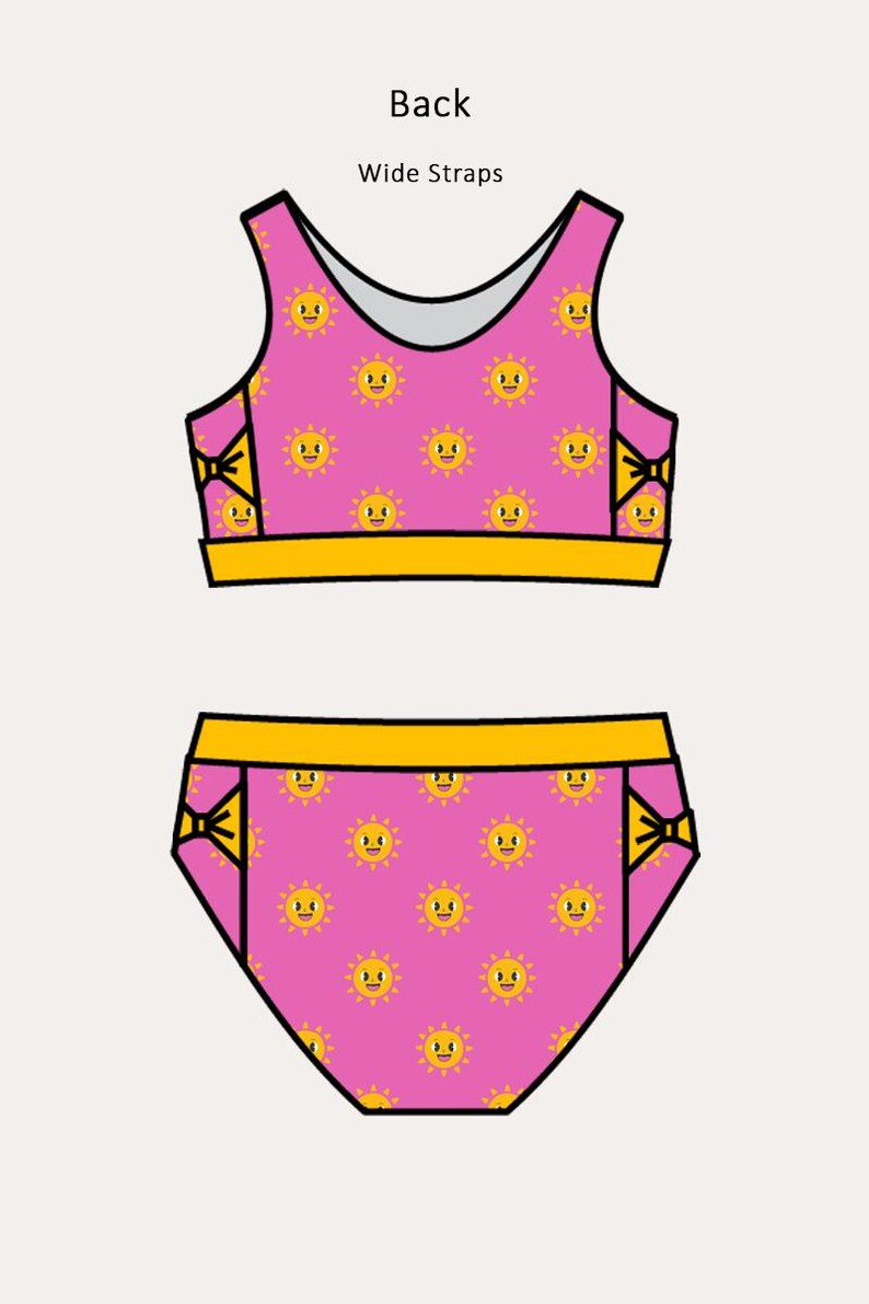 May include: A two-piece swimsuit set featuring a pink background with a repeating pattern of smiling yellow suns. The top has wide straps and the bottoms have yellow accents.