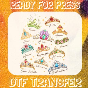 May include: A collection of colorful princess tiara designs, including Belle, Aurora, and Cinderella, with names written below each. The phrase "READY FOR PRESS" is at the top, and "DTF TRANSFER" is at the bottom. The background is a mix of orange, yellow, and purple.