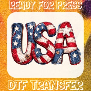 May include: A patriotic DTF transfer design featuring the word "USA" in red, white, and blue, with a denim and patchwork aesthetic. The letters are adorned with stars and stripes, and the text "READY FOR PRESS" and "DTF TRANSFER" are displayed.