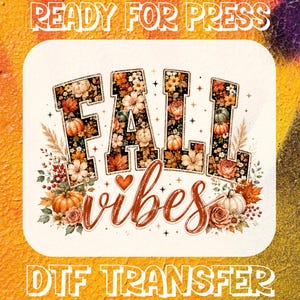 May include: A rectangular DTF transfer sheet featuring the text READY FOR PRESS at the top and DTF TRANSFER at the bottom. The centre displays the words FALL vibes in block and script lettering, decorated with orange pumpkins, autumn leaves, and flowers.