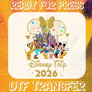 May include: DTF transfer featuring Disney characters, including Mickey and Minnie Mouse, Donald and Daisy Duck, Goofy, and Pluto. The design includes a castle, fireworks, and the text "Disney Trip 2026". The words "READY FOR PRESS" and "DTF TRANSFER" are also present.