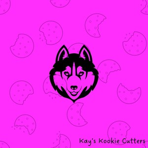 May include: A black and white husky dog face design on a bright pink background with cookie illustrations. The text "Kay's Kookie Cutters" is in the bottom right corner. This image is likely for a cookie cutter.