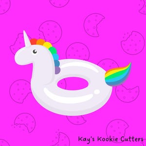 May include: A white unicorn-shaped pool float with a rainbow mane and tail. The float has a circular body with a hole in the center. The background is a bright pink with a pattern of cookie shapes. The text "Kay's Kookie Cutters" is in the bottom right corner.