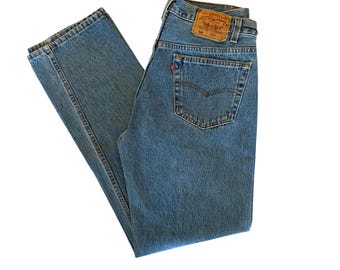 W31.5” L31.5" 501 90s USA Levi’s: faded medium wash (31.5" measured waist = modern women’s size 29), vintage levis 501