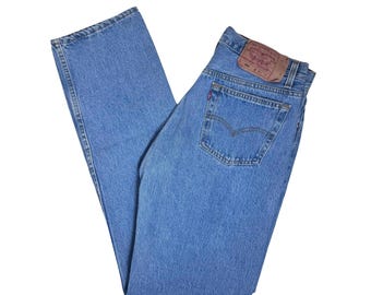 W32" L33” 501 90s USA Levi's Vintage Jeans: faded medium stonewash (32" measured waist = modern women’s size 29/30)