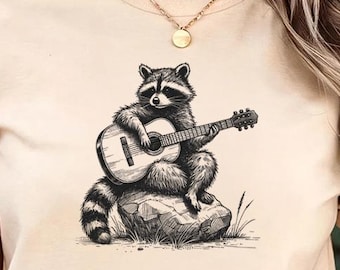 Maglietta con procione che suona la chitarra - Comfort Color® - Maglietta divertente con musica Trash Panda, maglietta rock acustica selvaggia, regalo per gli amanti della musica