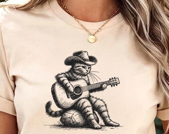 Maglietta con gatto da cowboy che suona la chitarra - Comfort Color® - Maglietta per gli amanti della musica western, maglietta rustica con gatto country, estetica divertente da cowboy