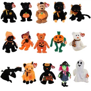 May include: A collection of Halloween-themed Beanie Babies plush toys. The assortment includes bears, cats, and other creatures dressed in costumes, such as pumpkins, witches, and ghosts. Each plush has a tag.