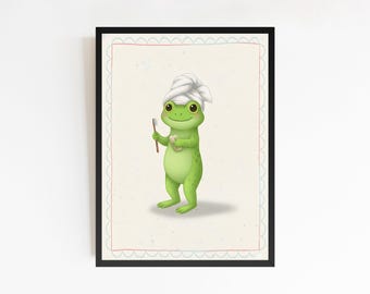 Könnte beinhalten: Ein gerahmter Druck mit einem Cartoon-Frosch. Der grüne Frosch trägt ein weißes Handtuch auf dem Kopf und hält eine Zahnbürste und einen kleinen Behälter. Der Hintergrund ist hellbeige mit einem dekorativen Rand. Der Rahmen ist schwarz.