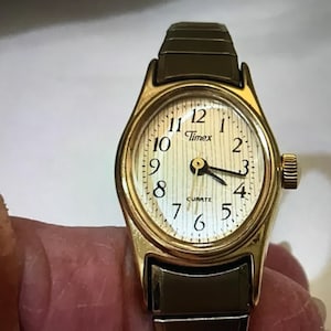 Vintage Timex Ladies Gold Tone Watch: Stainless Steel Bezel